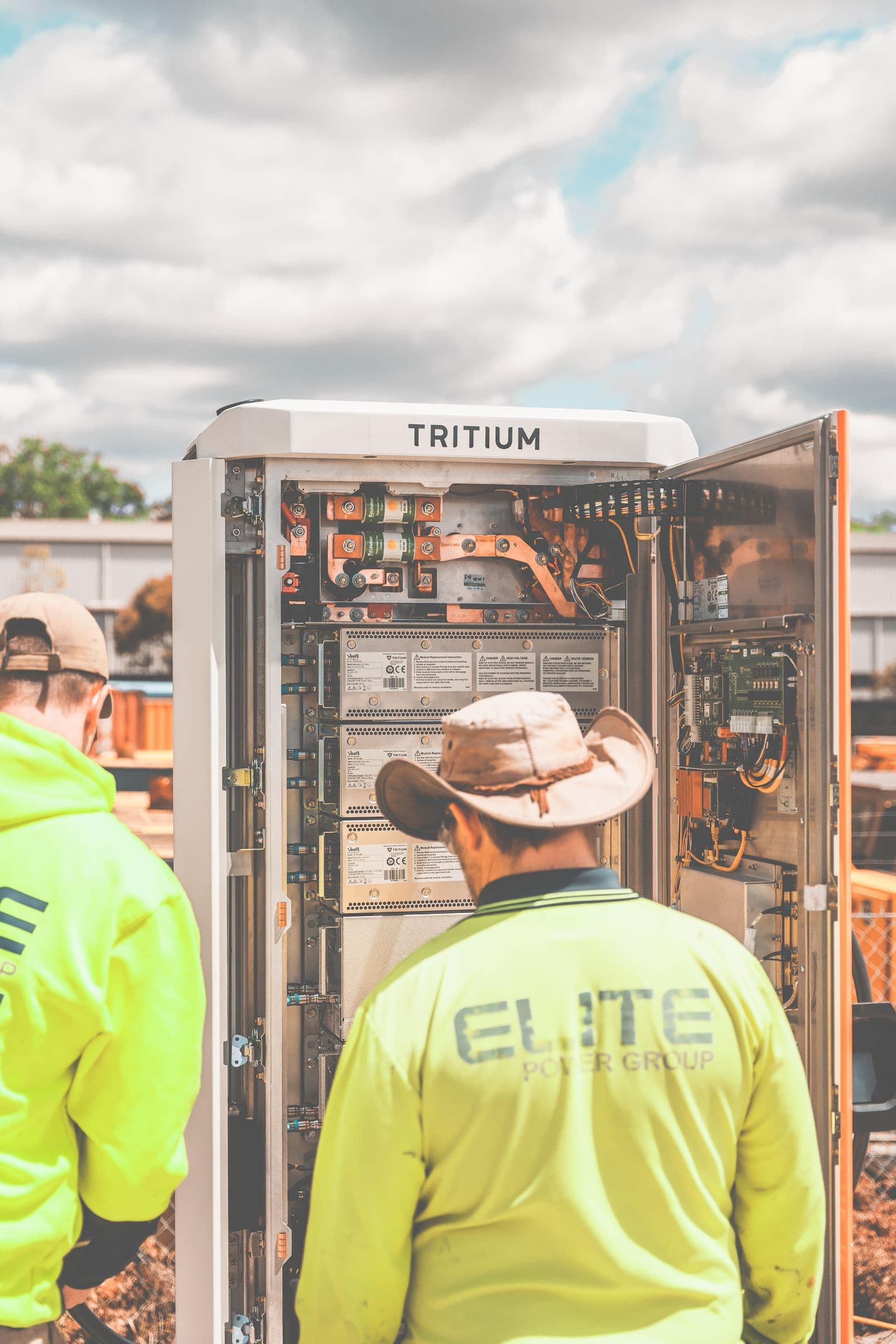 Technicians installing an EV charging station